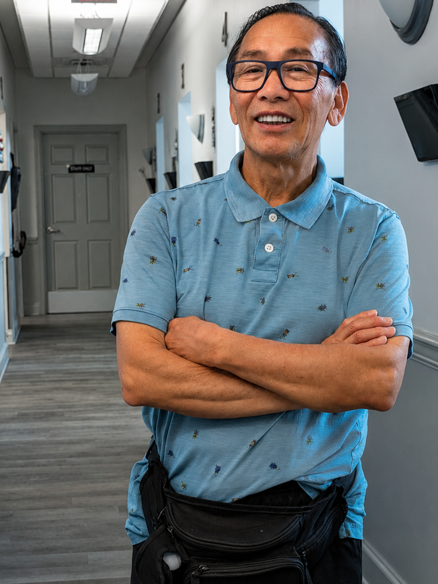 Corner Stone dental patient smiling in the hallway